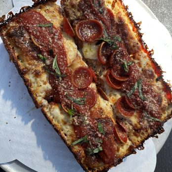 Rad Pies - a slice of pizza on a plate - Pizza Near Me - Williamsport, Maryland Rad Pies - a slice of pizza on a plate - Pizza Near Me - Williamsport, Maryland
