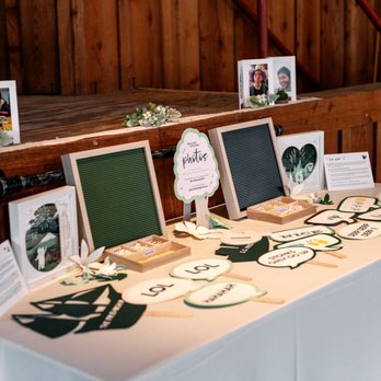 A Paper Flower Wedding - Photobooth prop table, set up by Sarah - Wedding Planning Near Me
