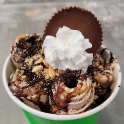 Cowbell Rolled Ice Cream - The Reaper! Peanut butter & chocolate icing chopped & rolled, drizzled w/ caramel & chocolate, topped w/ crushed peanuts, Oreo, Reese's cup