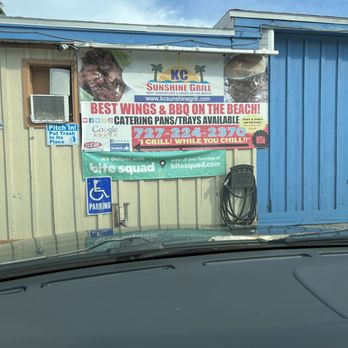 KC Sunshine Grill - a sign on the side of a building - Sandwiches Near Me - North Redington Beach, Florida