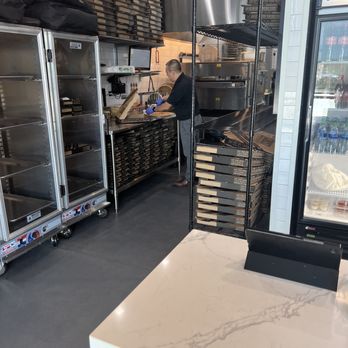 Crust Pizza Co - Pearland - a man working in the kitchen - Pizza Near Me - Pearland, Texas Crust Pizza Co - Pearland - a man working in the kitchen - Pizza Near Me - Pearland, Texas