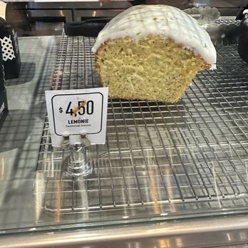 Tostado Cafe Club - a loaf of cake on a cooling rack - Coffee & Tea Near Me - Miami, Florida