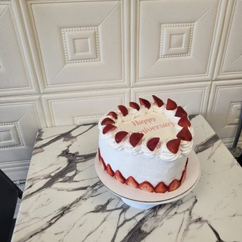R&B Kosher Bakery - a strawberry cake on a marble table - Bakeries Near Me - Phoenix, Arizona