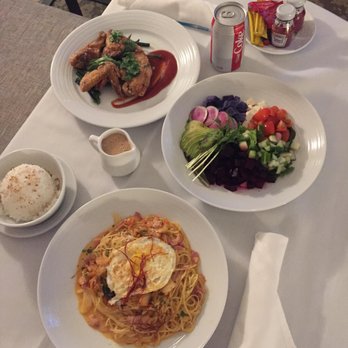Prince Waikiki - In room dining included fried chicken, Buddha bowl salad and kimchi bacon carbonara. - Hotels Near Me - Honolulu, Hawaii