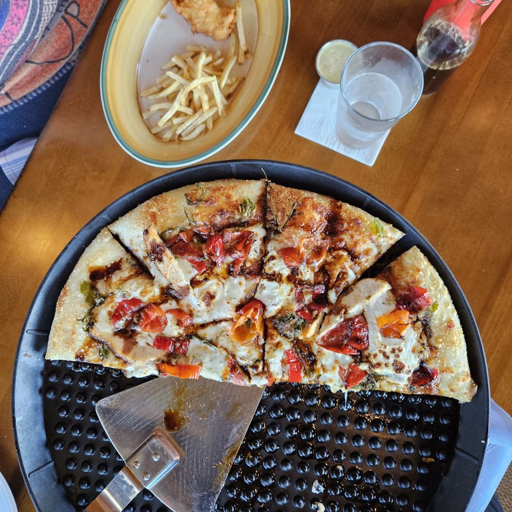 Fish & Chips along with Spicy Pelican Pizza. Fish & Chips along with Spicy Pelican Pizza.