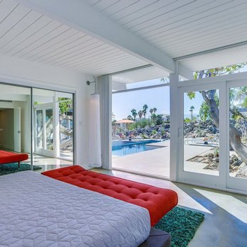 Blue Water Construction - a bedroom with a pool in the background - General Contractors Near Me - San Juan Capistrano, California Blue Water Construction - a bedroom with a pool in the background - General Contractors Near Me - San Juan Capistrano, California