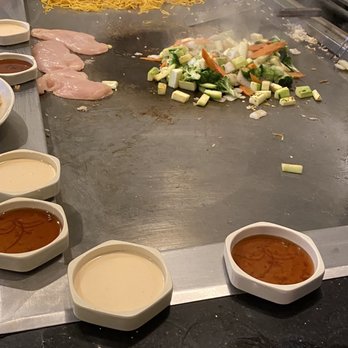 Mizu Teppanyaki & Sushi - a chef preparing food - Japanese Near Me - St. Cloud, Florida Mizu Teppanyaki & Sushi - a chef preparing food - Japanese Near Me - St. Cloud, Florida