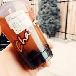 a person holding a cup of coffee