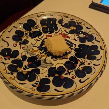 Carbone - Parmesian Reggiano, served alongside bread - Italian Near Me - Las Vegas, Nevada