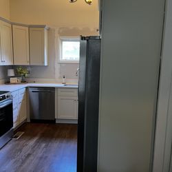 Cabinets To Go - Cabinet and fridge difference. Looks like a guy wearing too short of pants.