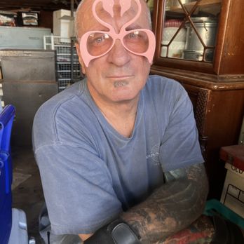A Better Solution Estate Sales - Scotty working in the garage & takes time out to model these fantastic flamingo glasses - Estate Liquidation Near Me - Signal Hill, California A Better Solution Estate Sales - Scotty working in the garage & takes time out to model these fantastic flamingo glasses - Estate Liquidation Near Me - Signal Hill, California