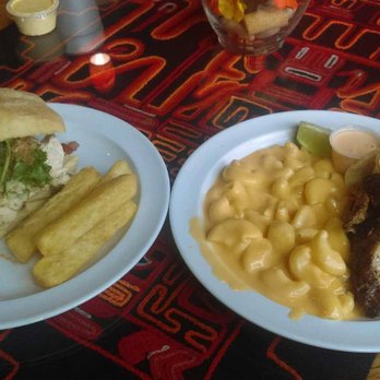 Inka Chicken - Left: Chicken Sandwich and Yucca fries. Right: 1/4 chicken and Mac n Cheese. - Peruvian Near Me - Austin, Texas Inka Chicken - Left: Chicken Sandwich and Yucca fries. Right: 1/4 chicken and Mac n Cheese. - Peruvian Near Me - Austin, Texas