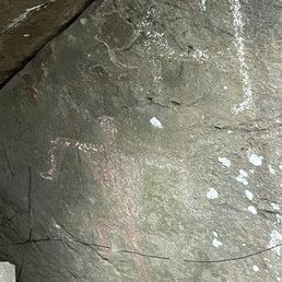 Petroglyphs, secured by a gate.