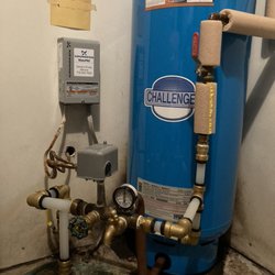 Gordy's Pump Service - After: The insulated pipes darkened copper pipes were original. The new fittings include the plastic pieces, elbows and spigot.