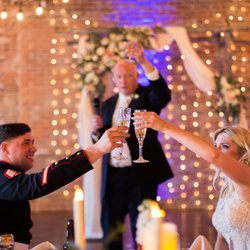 The McGinnity Room - Dad toasting the bride and groom in front of their alter and curtain of lights