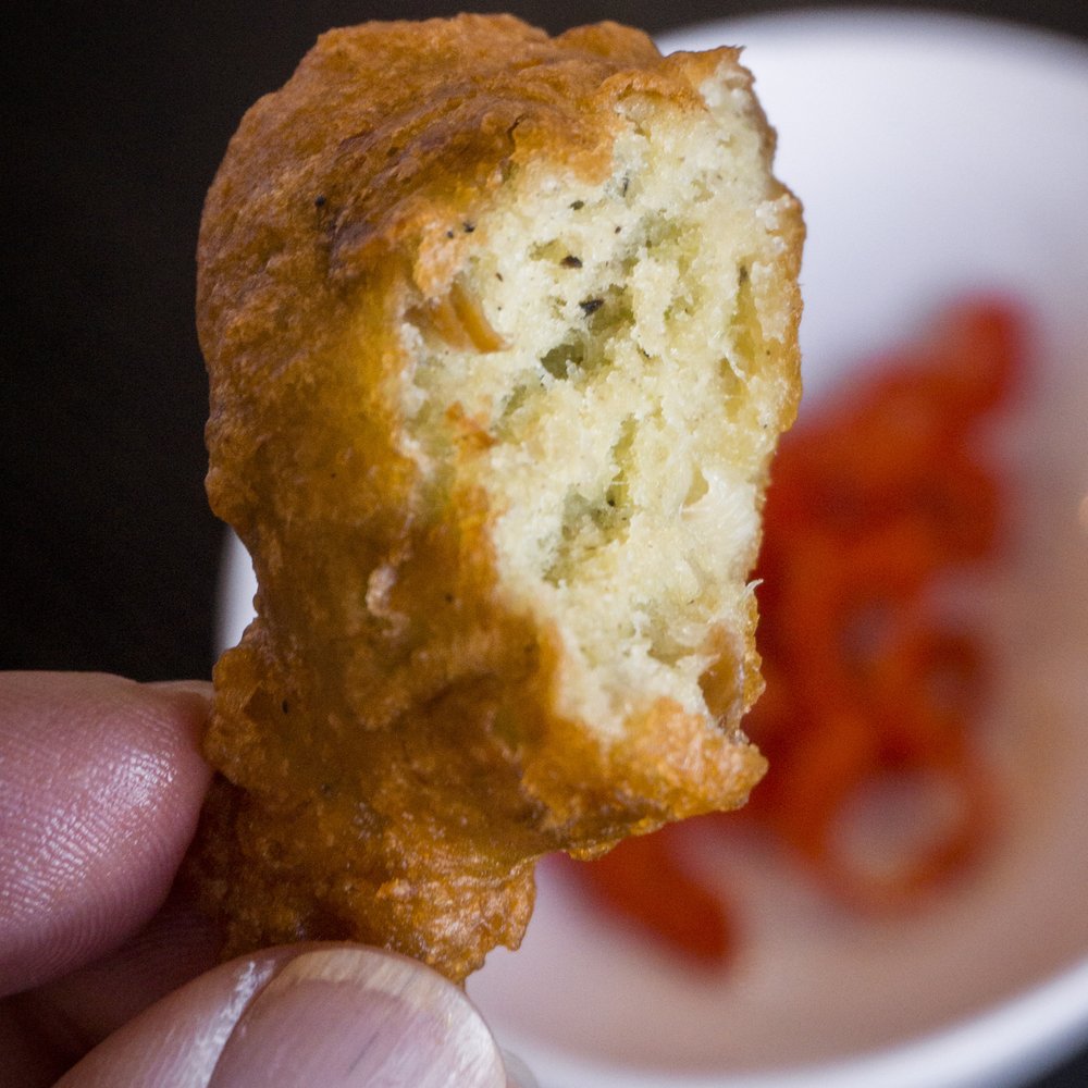 Beryl's Pepper Pot - Saltfish Fritters. Cod fish, red pepper and green onions in a light, tasty fritter. - Caribbean Near Me - Pickering, Ontario Beryl's Pepper Pot - Saltfish Fritters. Cod fish, red pepper and green onions in a light, tasty fritter. - Caribbean Near Me - Pickering, Ontario