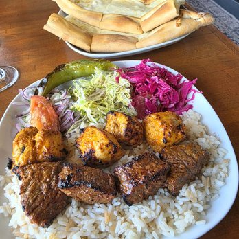 Turkish Kitchen - Mix Shish with Peynirli Pide in the background - Mediterranean Near Me - Brandon, Florida
