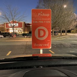 a parking sign in a parking lot a parking sign in a parking lot