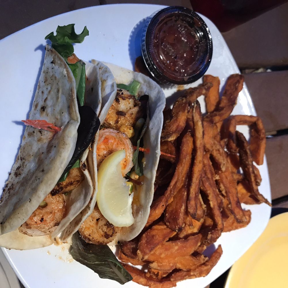Coconuts On The Beach - Shrimp tacos with sweet potato fries. The portion was ok not huge but definitely enough to get you full. - Bars Near Me - Cocoa Beach, Florida Coconuts On The Beach - Shrimp tacos with sweet potato fries. The portion was ok not huge but definitely enough to get you full. - Bars Near Me - Cocoa Beach, Florida