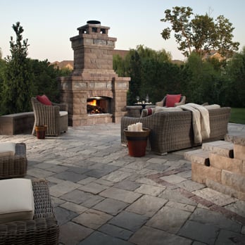 Landworks - a patio with furniture and a fire place - Landscaping Near Me - Kansas City, Kansas Landworks - a patio with furniture and a fire place - Landscaping Near Me - Kansas City, Kansas