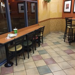 a view of a restaurant with tables and chairs
