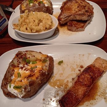 LongHorn Steakhouse - Upper: double porkchop, loaded potato, mac n cheese. Lower: 7 oz glazed salmon, loaded potato & chopped salad (unseen). - Steakhouses Near Me - Homestead, Florida
