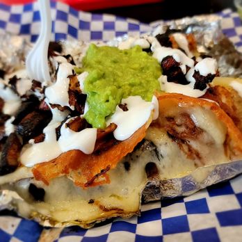 Tacos El Callejon - Same yummy loaded potato just a view of the whole plate. - Tacos Near Me - Colton, California Tacos El Callejon - Same yummy loaded potato just a view of the whole plate. - Tacos Near Me - Colton, California