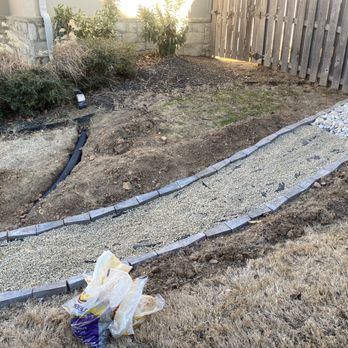 Irrigation HQ - French drain getting its decorative rock - Irrigation Near Me