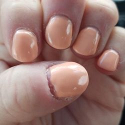 Nails barely filed. Cuticles not touched. Awful paint job.