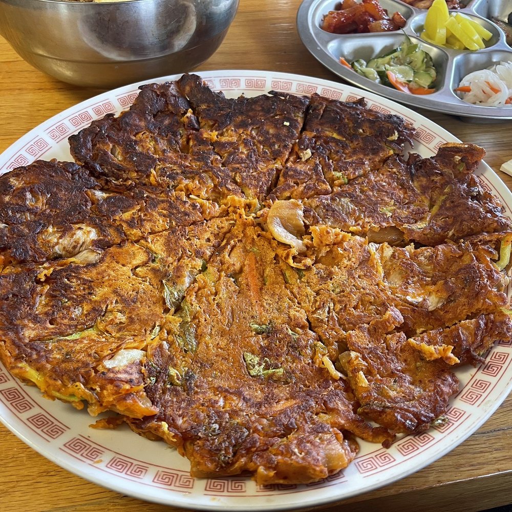 Four Seasons Asian Restaurant - Kimchi Pancake was so tasty!!! Its about the size of a medium pizza so make sure to order with somebody to share! - Korean Near Me - Junction City, Kansas Four Seasons Asian Restaurant - Kimchi Pancake was so tasty!!! Its about the size of a medium pizza so make sure to order with somebody to share! - Korean Near Me - Junction City, Kansas