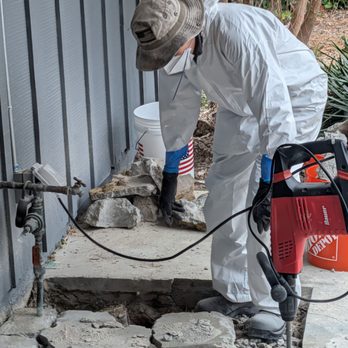 Trustworthy Plumbing - Jay digging out the front porch to remove and replace the old cast iron T cleanout. - Plumbing Near Me - San Diego, California Trustworthy Plumbing - Jay digging out the front porch to remove and replace the old cast iron T cleanout. - Plumbing Near Me - San Diego, California