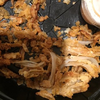 Texas Roadhouse - Only 2/3 of my onion blossom was even edible. This is all the soggy clumps and all the breading that fell off of the onions - Steakhouses Near Me - Abilene, Texas
