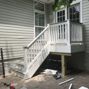 S K Services - a house with a deck and stairs - Lawn Services Near Me S K Services - a house with a deck and stairs - Lawn Services Near Me