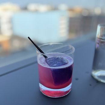 Knoop - a purple drink in a glass with a straw - German Near Me - Grand Rapids, Michigan