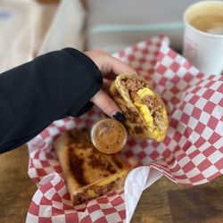 The Coffee Shop - Delicious and filling bacon egg potato cheese burrito with spicy chipotle sauce