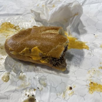 The Cheesesteak Guy - a half eaten sandwich - Cheesesteaks Near Me - Lemoyne, Pennsylvania