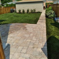 True Landscape - Complete Backyard redesign. New patio/walkway, freshly installed sod, and some beautiful shrubs.