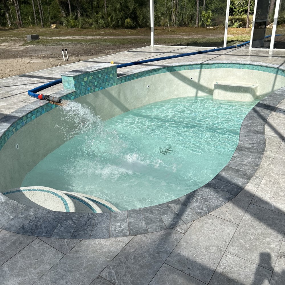 Summit Pools - Filler Up. An exciting moment after months of hard work. - Pool & Hot Tub Service Near Me - Naples, Florida