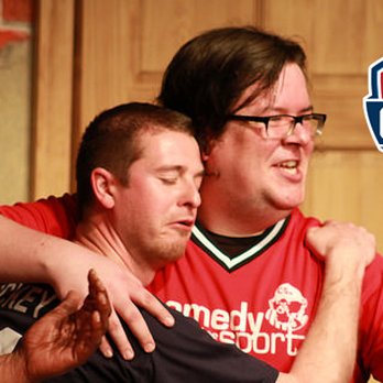 ComedySportz - a group of men in red shirts - Comedy Clubs Near Me - Milwaukee, Wisconsin