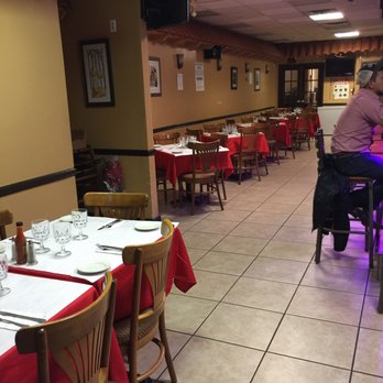 La Palma Restaurant - the dining area with tables and chairs - Sports Bars Near Me - Freeport, New York