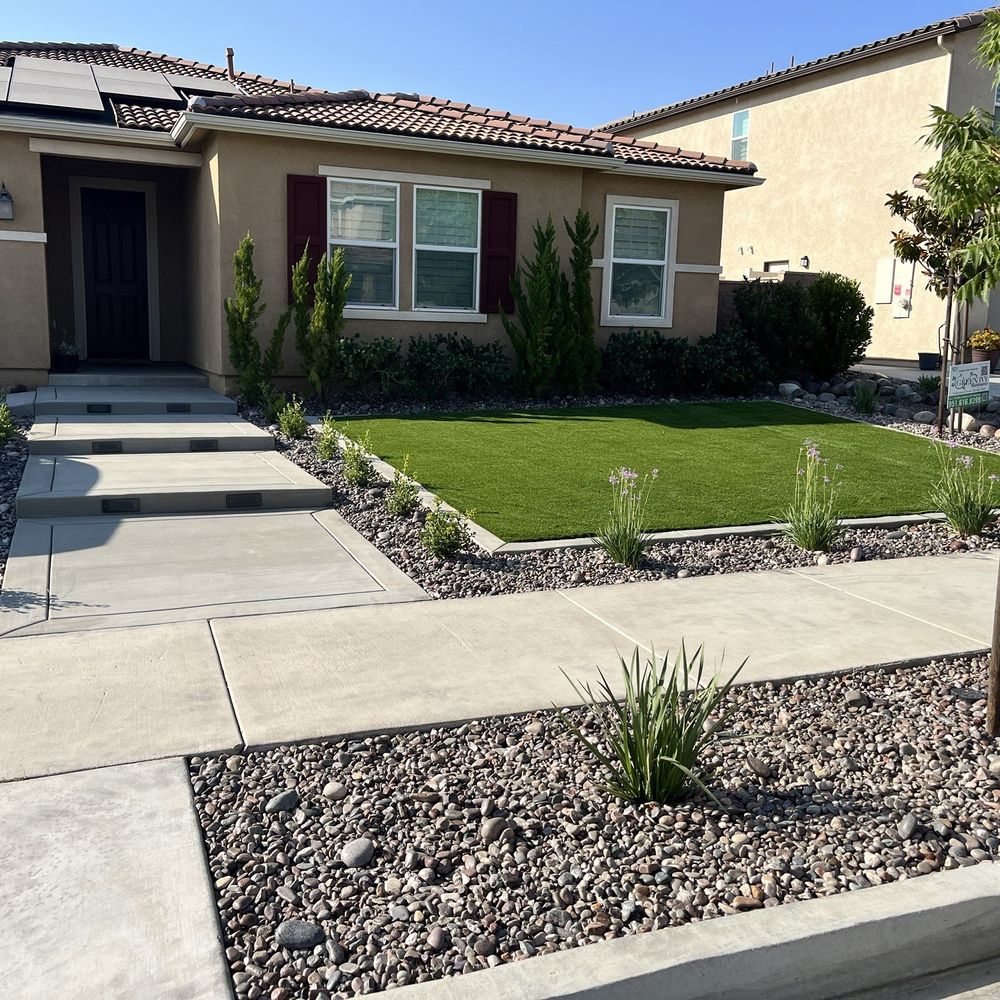 Green Ivy Maintenance - Front yard landscaping: turf, rock, concrete steps, plants and lights. - Landscaping Near Me