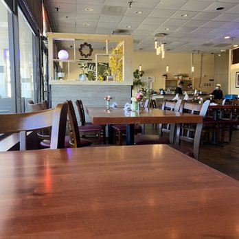 Twisted Noodles - a table and chairs in a restaurant - Thai Near Me - Durham, North Carolina