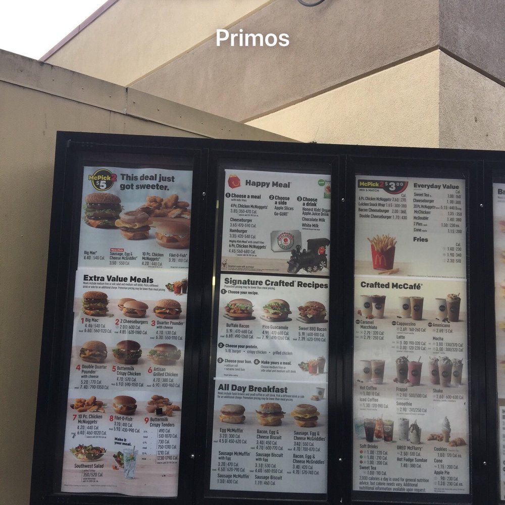 menus and prices on the outside of a restaurant menus and prices on the outside of a restaurant