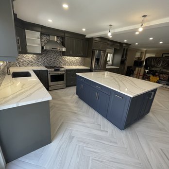 FLP Contracting - a kitchen with a marble island - General Contractors Near Me FLP Contracting - a kitchen with a marble island - General Contractors Near Me