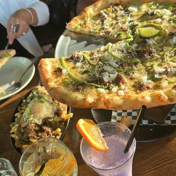 Oribello’s Bar & Kitchen - Birria Pizza, Loco Moco Fries, Ube Coloda, Lychee Spritz - Sports Bars Near Me - Austin, Texas Oribello’s Bar & Kitchen - Birria Pizza, Loco Moco Fries, Ube Coloda, Lychee Spritz - Sports Bars Near Me - Austin, Texas