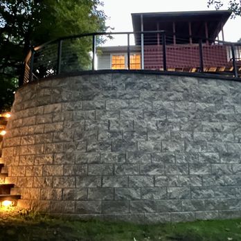 Primo Landscape Design - Large retaining wall with step lights in West Nyack, NY. - Lawn Services Near Me - West Nyack, New York