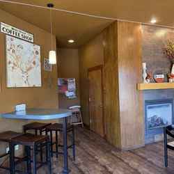 Soco Coffee - Some of the seating (including child high chair), and fire place