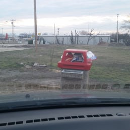 a red car parked in a parking lot