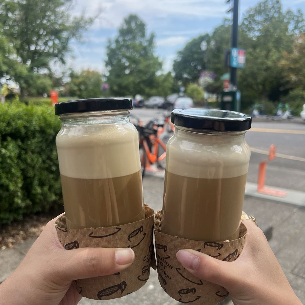 Our Spot - honey latte (left) vanilla chai with cinnamon on the top (right) - Coffee & Tea Near Me - Portland, Oregon