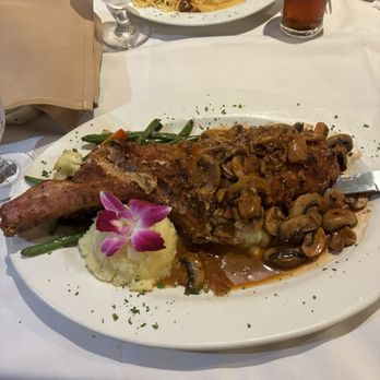Casa di Fratelli - Stuffed tomahawk pork chop special - Italian Near Me - Westbury, New York Casa di Fratelli - Stuffed tomahawk pork chop special - Italian Near Me - Westbury, New York